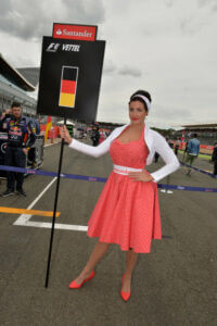 formula 1 girl holding sebastian vettel flag at british GP