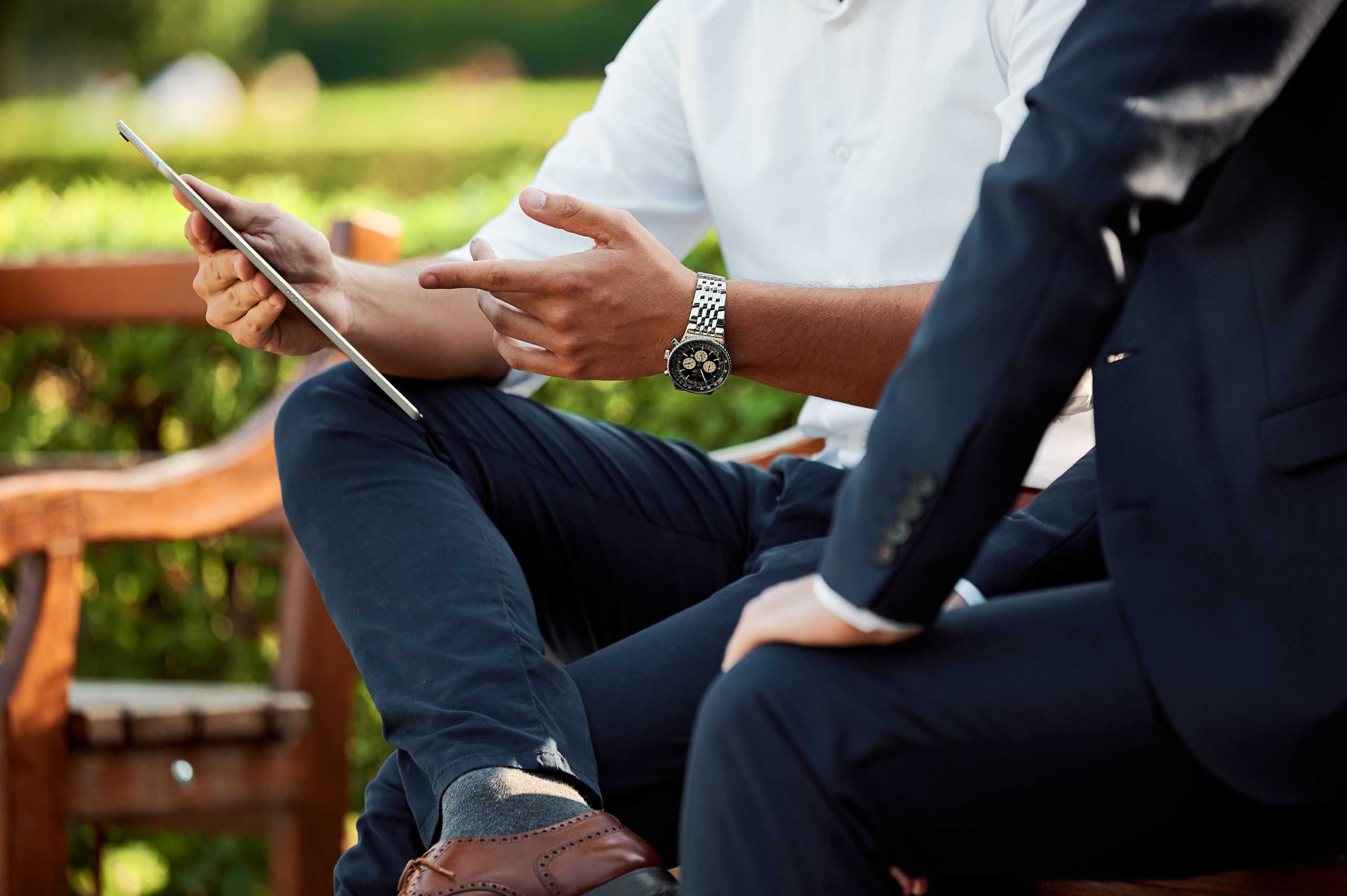 Man Pointing at Ipad - 3 Ways to Foster Innovation in Your Marketing Strategy