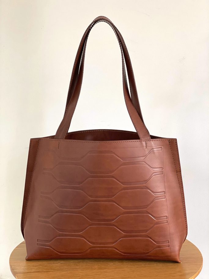 Gallery is a chestnut debossed leather tote