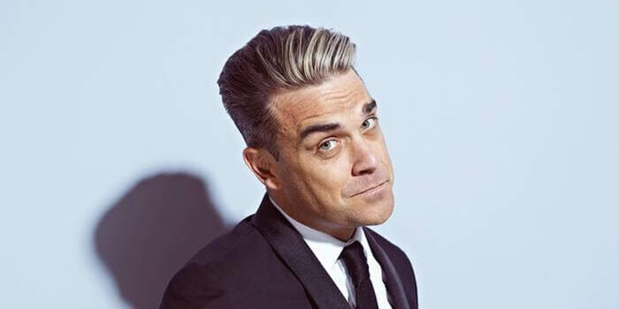 Robbie Williams supera récords de venta y abre un segundo concierto