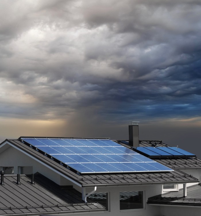 solar-panels-on-house-rooftop-with-dark-sky