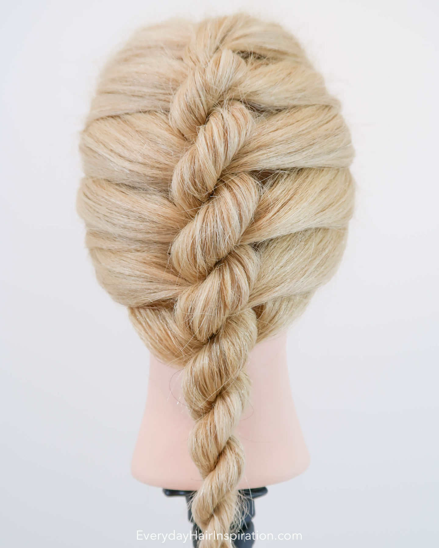 Blonde hairdresser doll with a single french rope braid in the hair - Looking at the braid straight on from the back