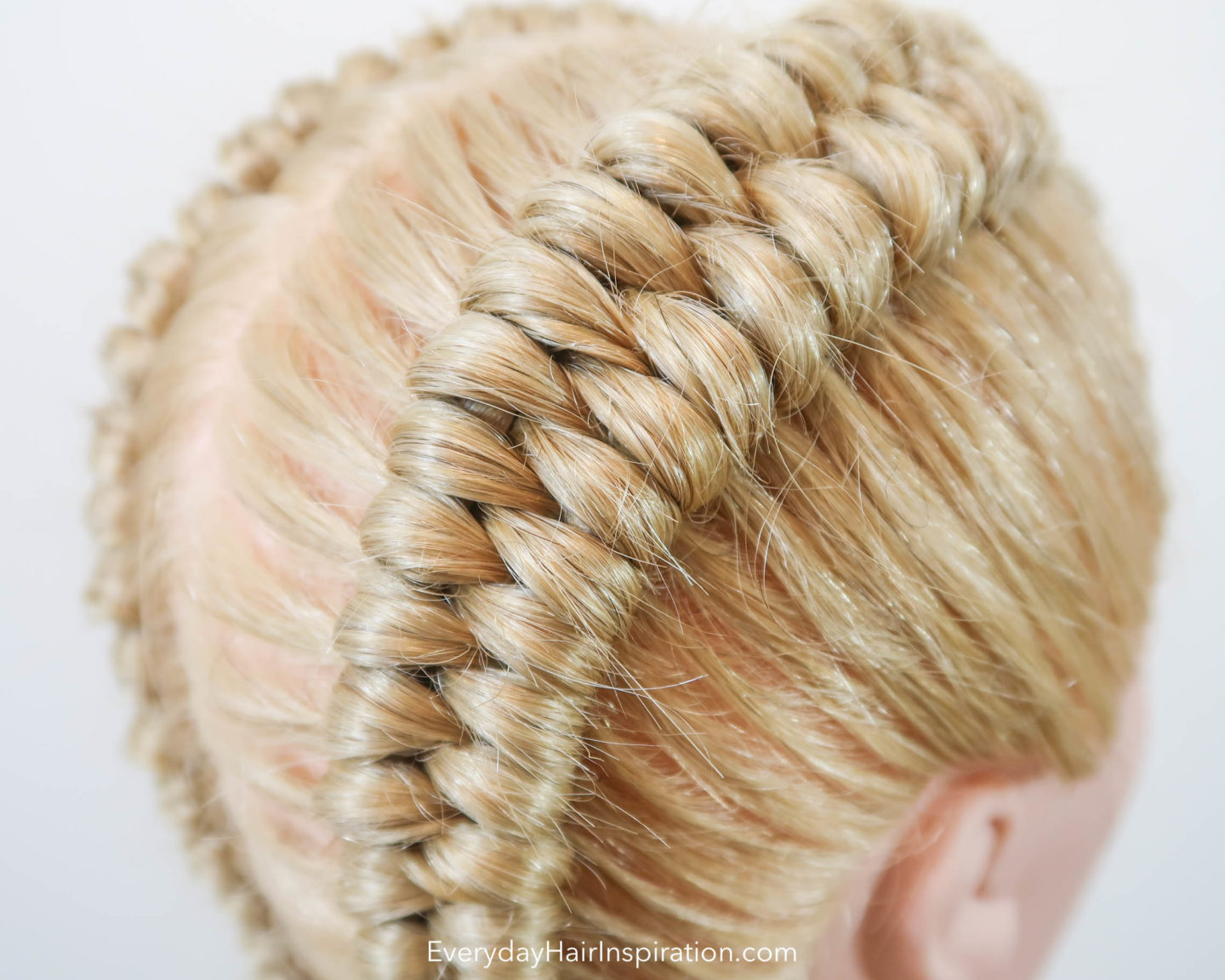 Closeup of a dutch infinity braid in blonde hair