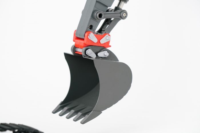 red EXAPUR quick coupler mounted on the excavator arm of the VOLVO EC160E (1:16) excavator for the original bucket