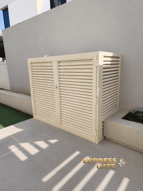 Custom outdoor louvered storage unit for pool pump/heater system cabinet installed in Dubai and Abu Dhabi villas, featuring durable weather-resistant louver doors