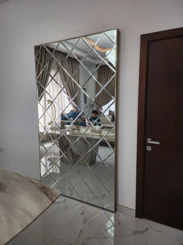 Gold Concealed sliding magic door with full-length mirror installed in Dubai and Abu Dhabi luxury homes, popular for kitchens and bathrooms