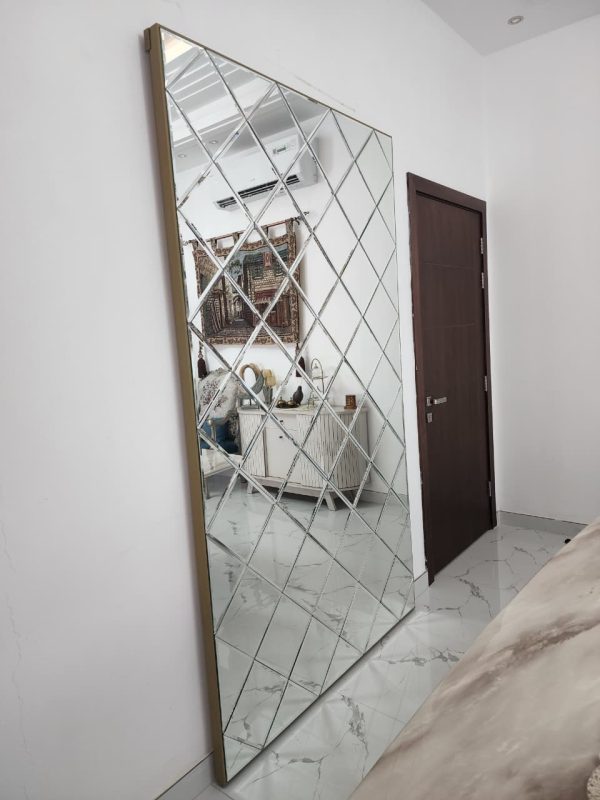 Gold Concealed sliding magic door with full-length mirror installed in Dubai and Abu Dhabi luxury homes, popular for kitchens and bathrooms