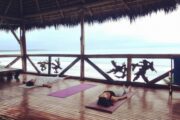 Yoga class at Pacific Ocean in Acantilado