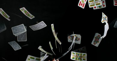 playing cards on black textile