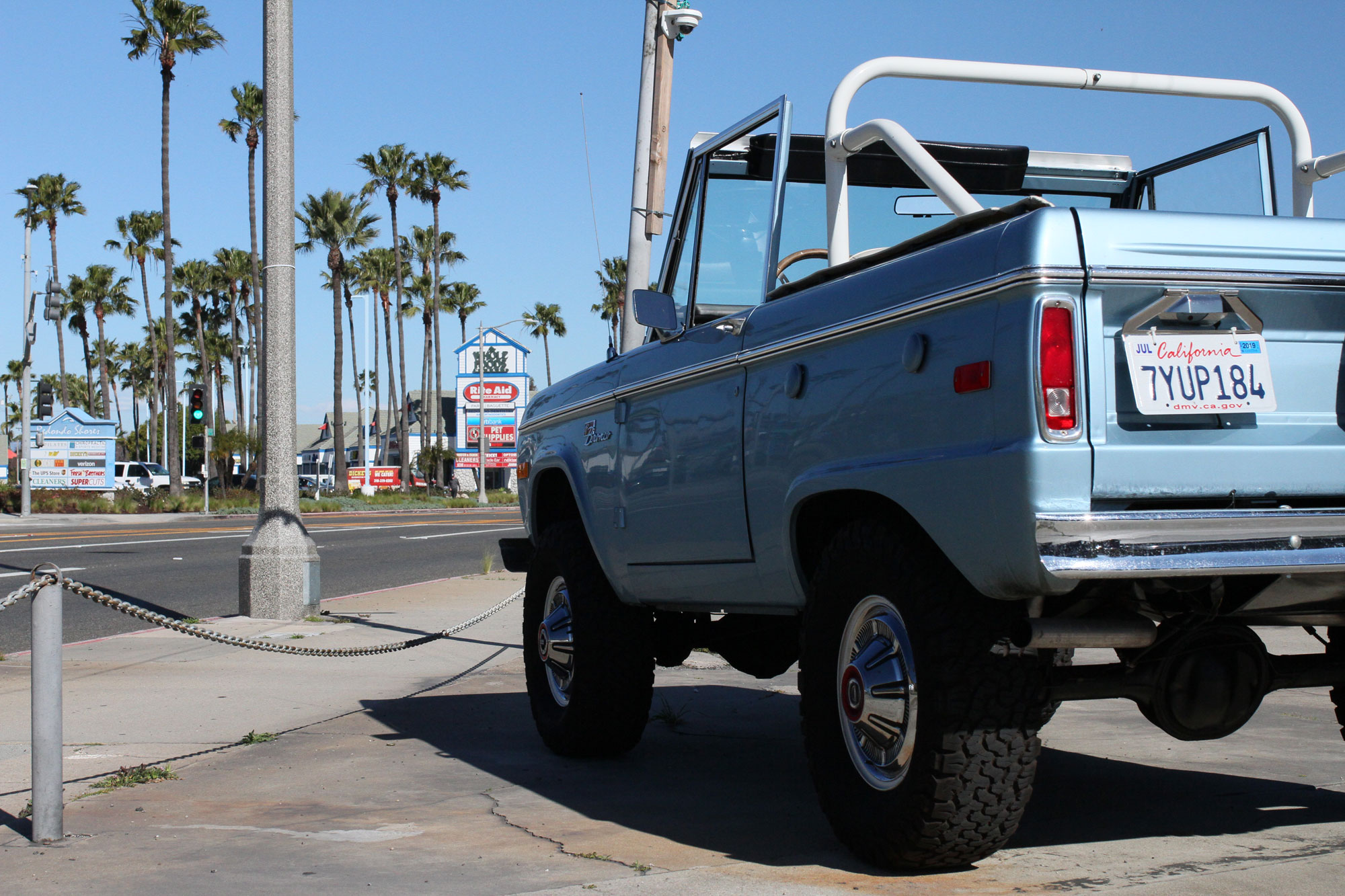 The tip top light blue Bronco beside Highway One in RodendoBeach