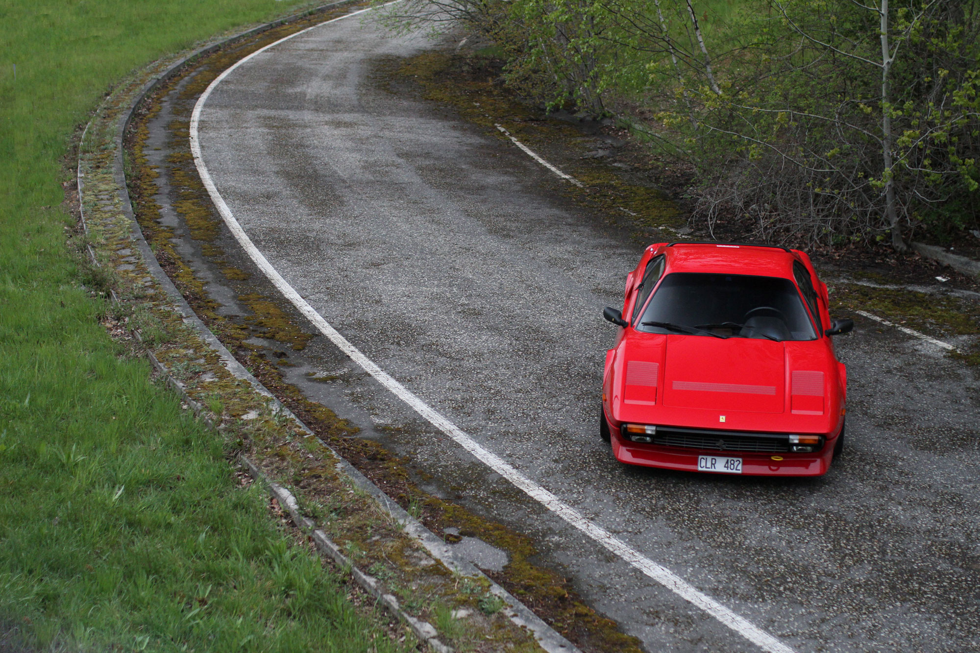 the Ferrari 308 GTB QV - 1984 in the deserted highway exit