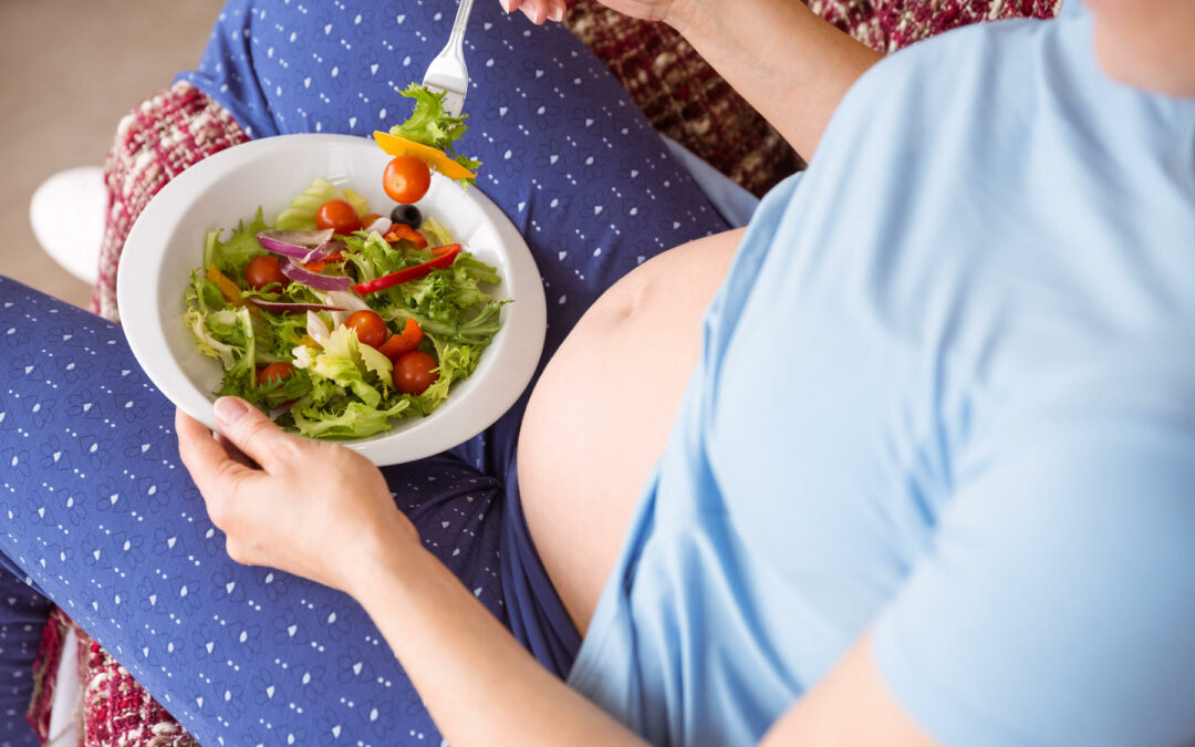 woman eating food during pregnancy