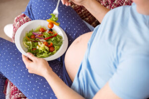 woman eating food during pregnancy