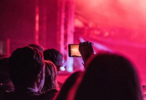 Man taking photograph at festival