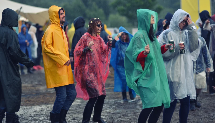 wearing poncho or rain jacket at muddy festival