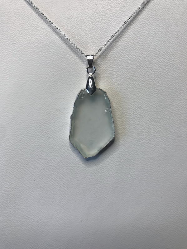 a necklace with a white stone pendant