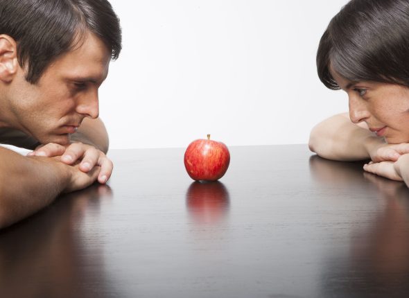 Hispanic couple with apple