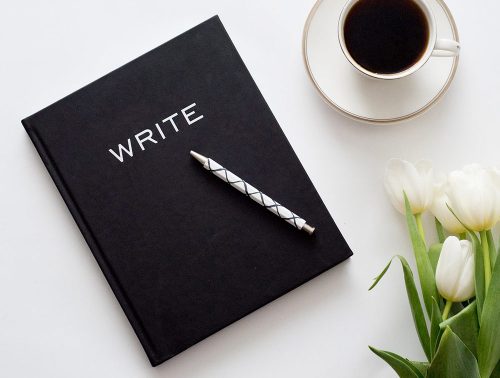 Writing journal and coffee