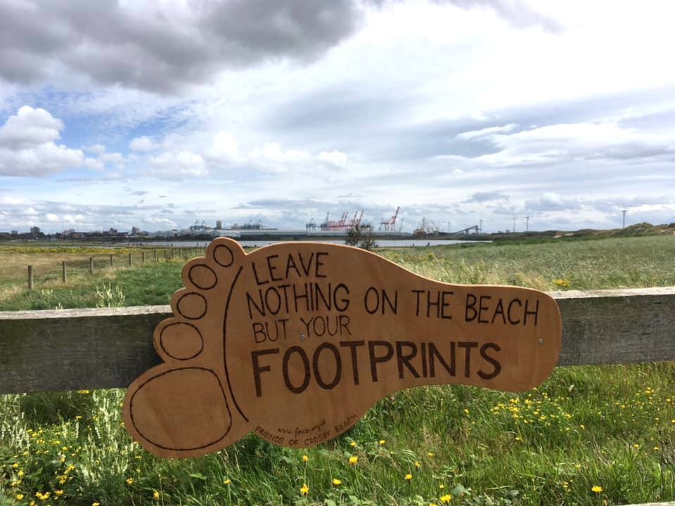 Footprint sign on railings