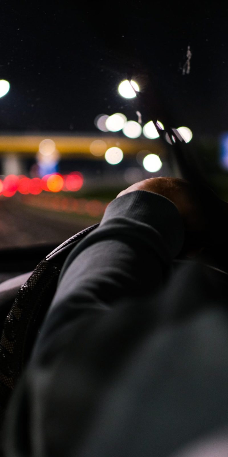 man-driving-a-car-at-night-2022-11-10-18-38-14-utc