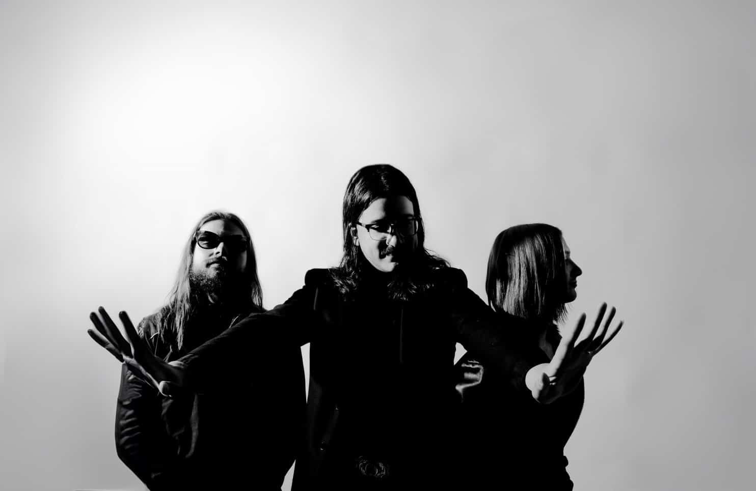 three men from Midnight 30 group in black and white