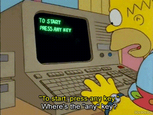 Screenshot gif of Homer Simpson trying to find the 'any' key on a keyboard