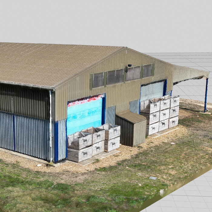 A 3D model of a metal barn created from images taken with a drone as part of a survey.