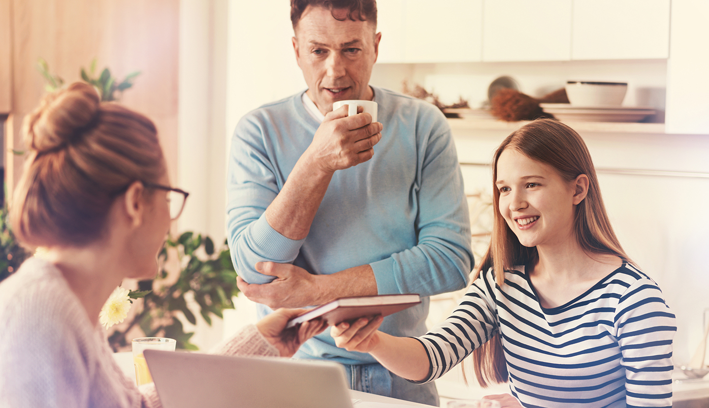 You may check. Positive delighted teenager feeling happiness while having good result and looking at her parent