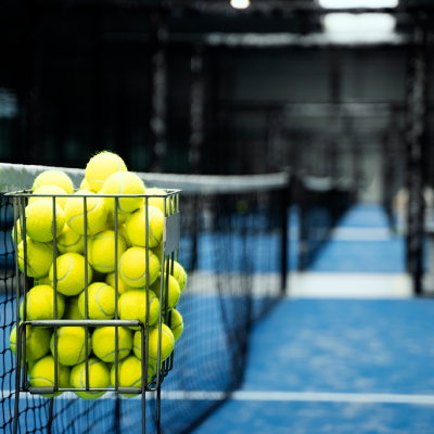 empty-paddle-tennis-field-with-balls-basket