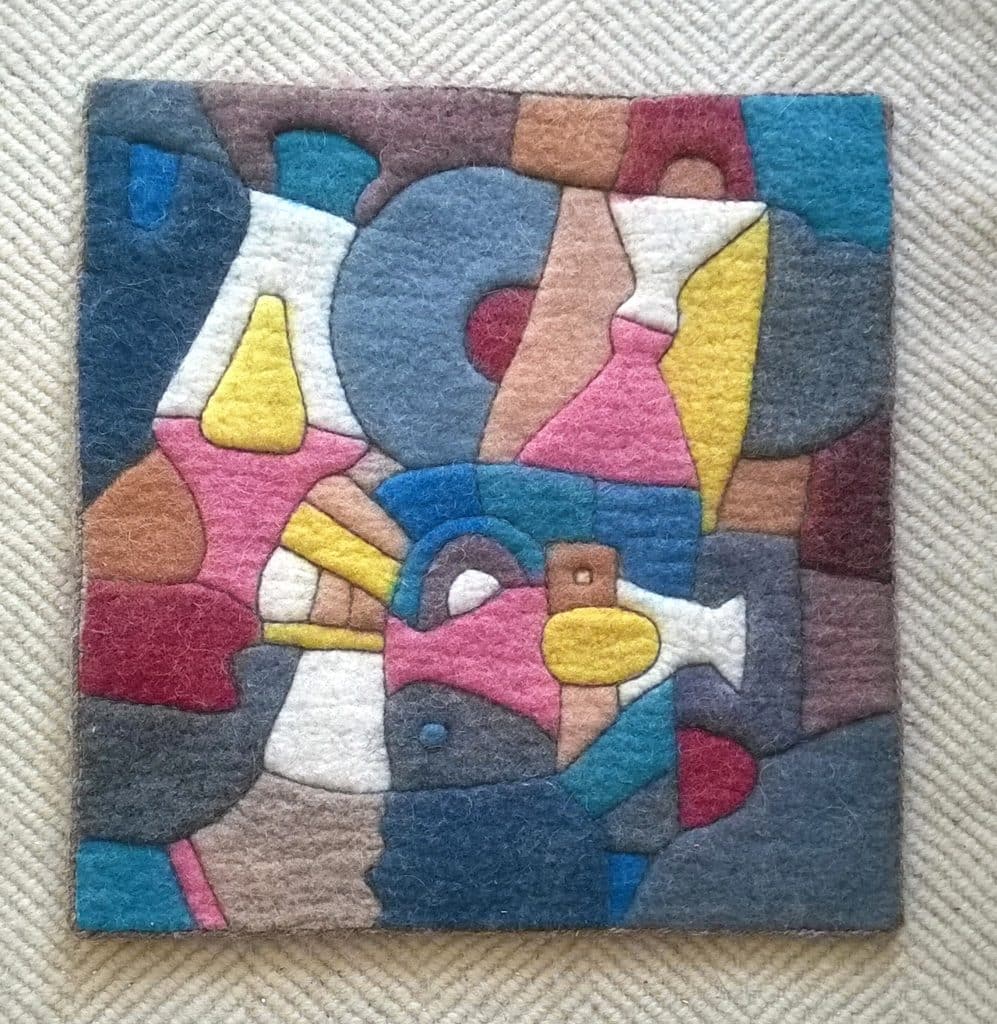 Picture with geometrical colours and relief stiching.