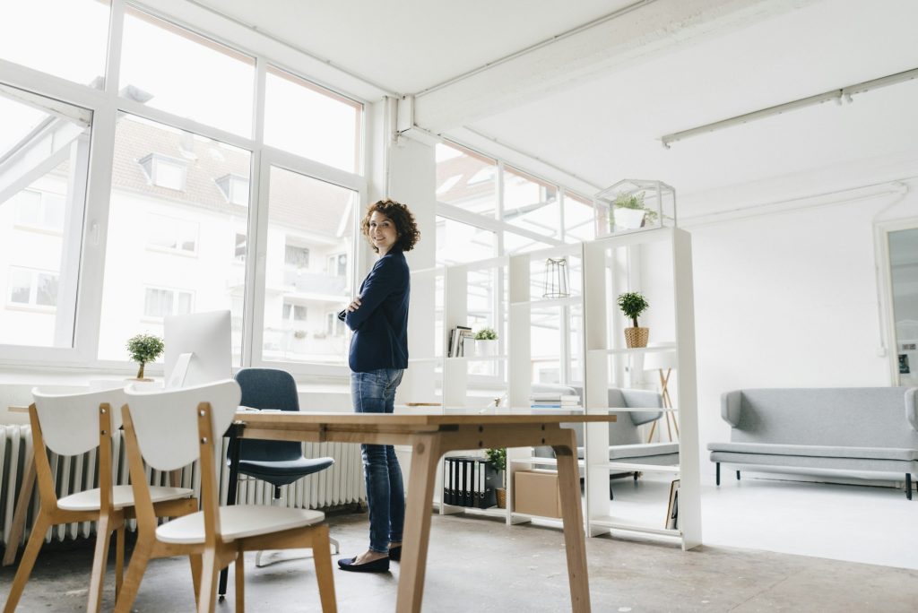 Businesswoman in office, looking confident