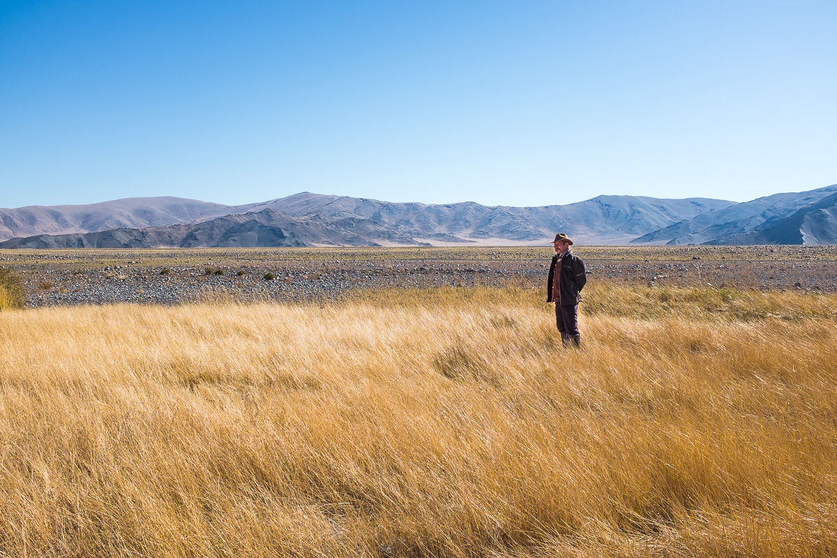 Mongolians are proud people and proud of their heritage and their country. Man enjoys the vast open space, sunshine and breeze of his land. This is his moment, his country.