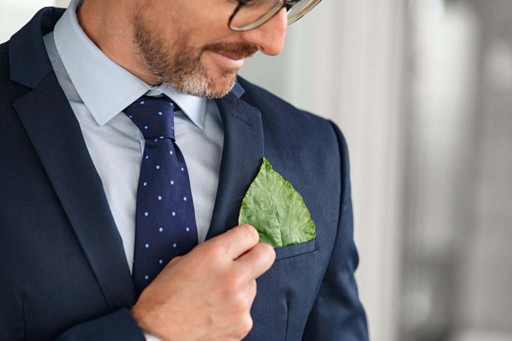 Business,Man,In,Formal,Clothing,Touching,Green,Leaf,In,Coat