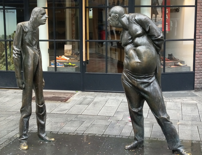 Sculpture of two ugly men