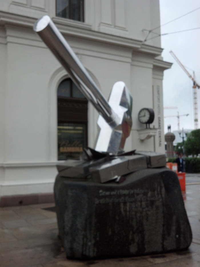 Sculpture showing hammer crushing swastica