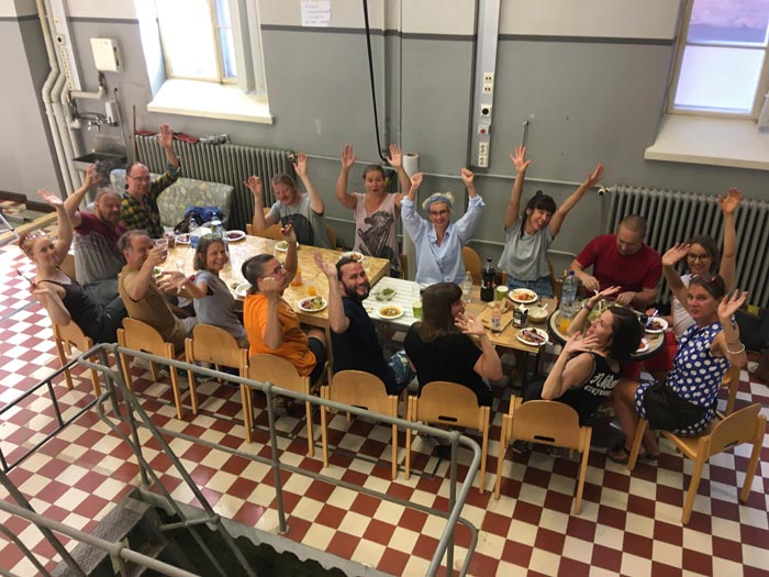 Huuto member artists eating while building the new Huuto on Eerikinkatu 2018