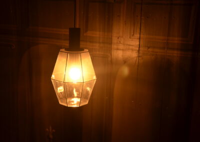 A lampshade, illuminated