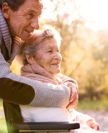 elderly-man-arms-around-elderly-woman elderly-man-arms-around-elderly-woman