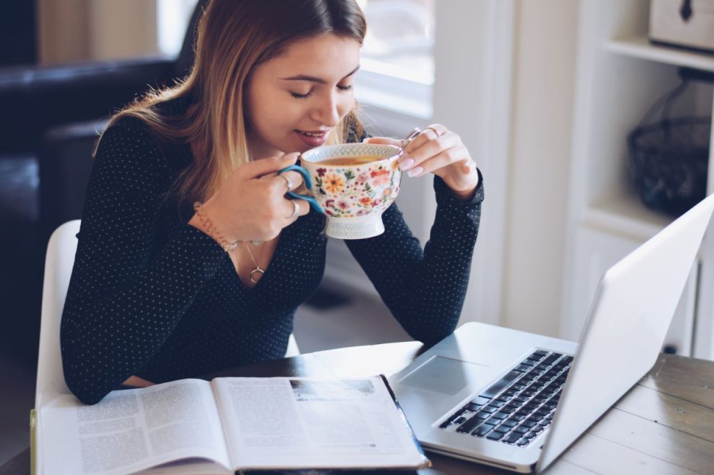 student properties, a girl drinking tea while studying