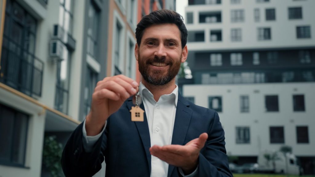 low epc rating, a man holding a house key