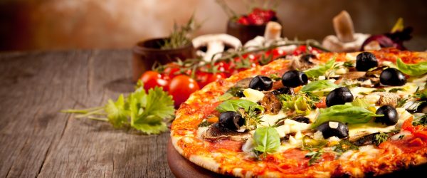 Delicious fresh pizza served on wooden table