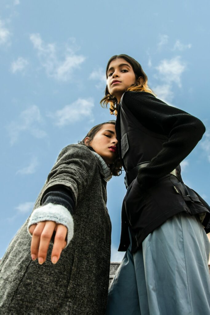 Two girls standing and posing