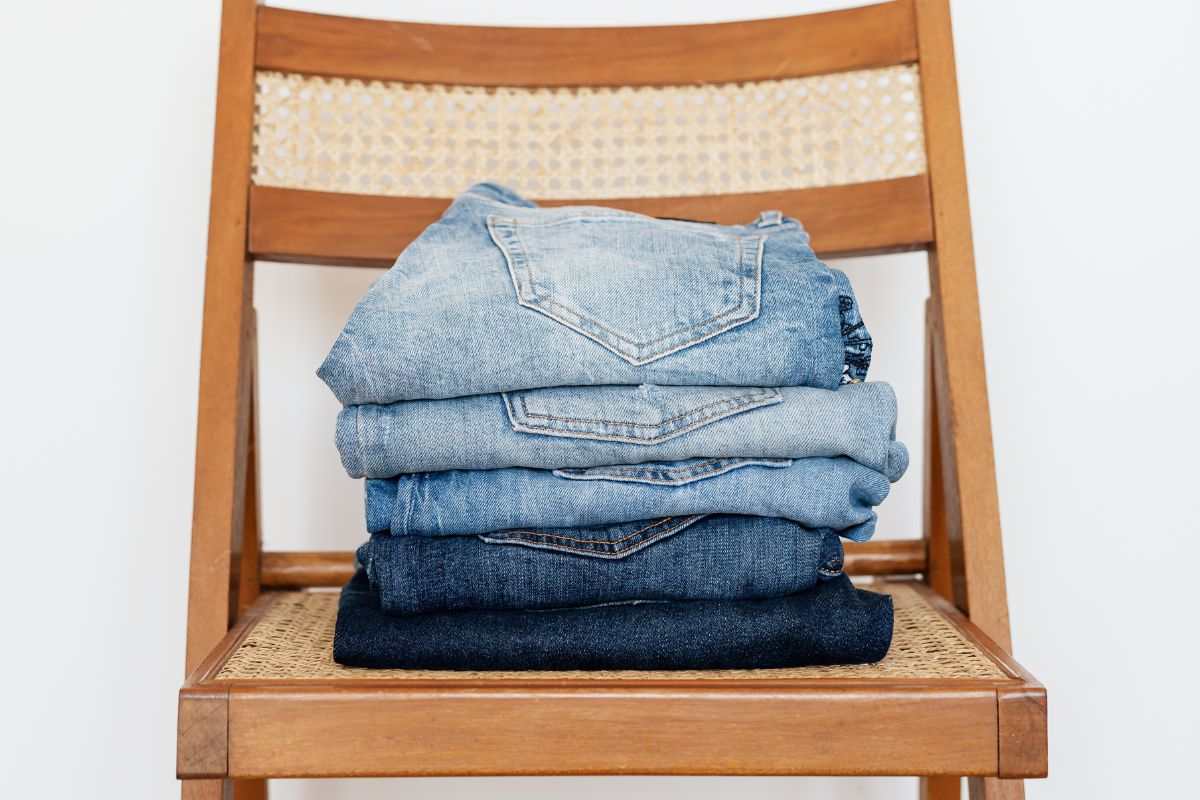 Women's jeans in different Blue color shades on a chair