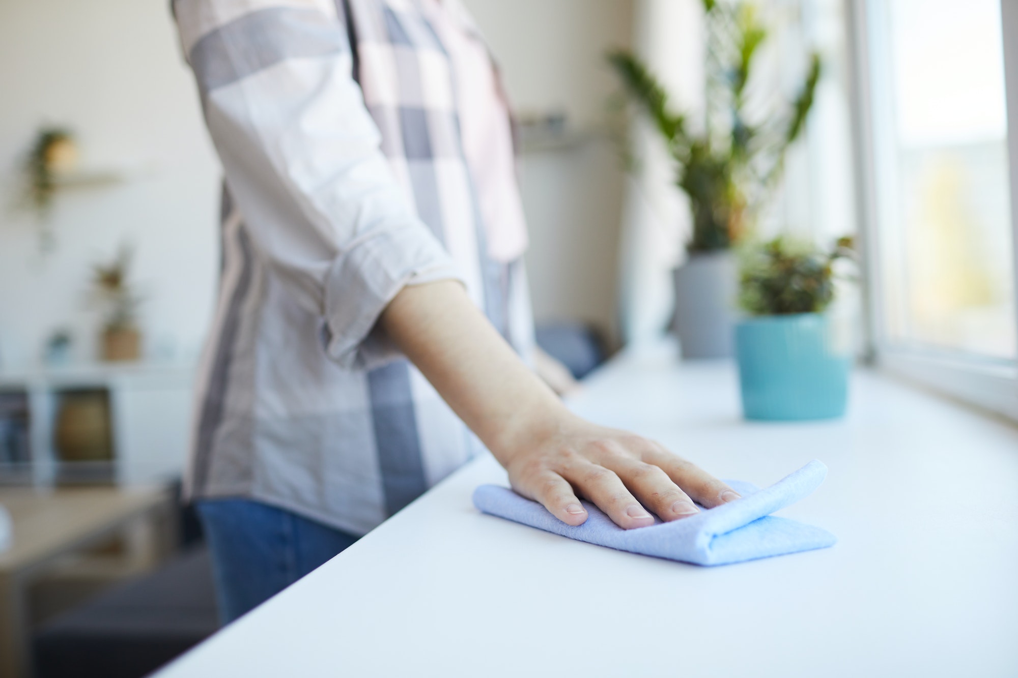 Woman cleaning the room