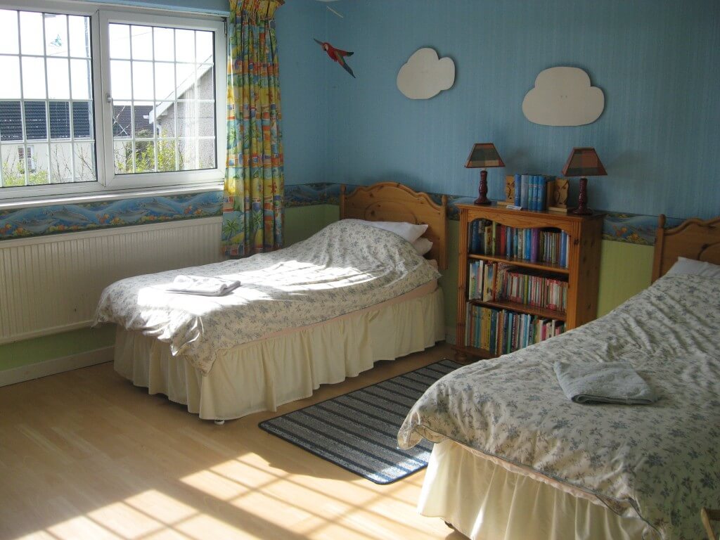 One of the three twin bedrooms