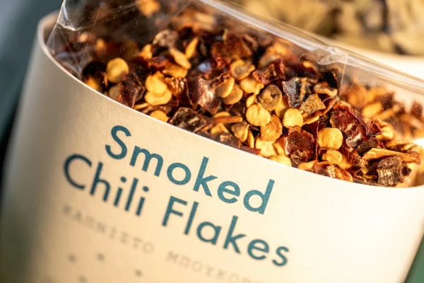 Smoked chili flakes often sprinkled over yogurt as seasoning for meat grills. They are also the main ingredient in baked feta cheese.