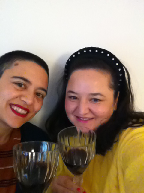 Seda and Seyda in a selfie saying cheers with wine