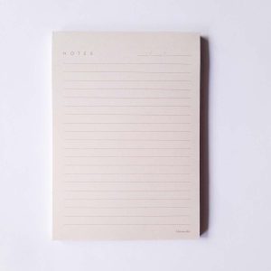 Ruled Hamide Basics notepad in light peach background in A6 size
