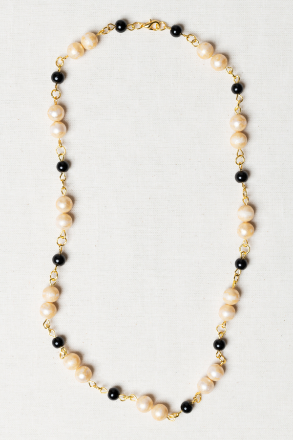 Golden necklace with vintage pearls and black beads