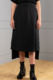 black straight-skirt with drop-tail hemline